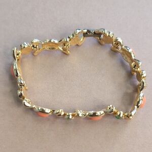 Elegant Gold and Coral Bracelet